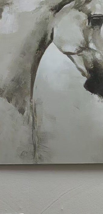 A grey horse head emerges from a loose, atmospheric background of soft charcoal-like tones.