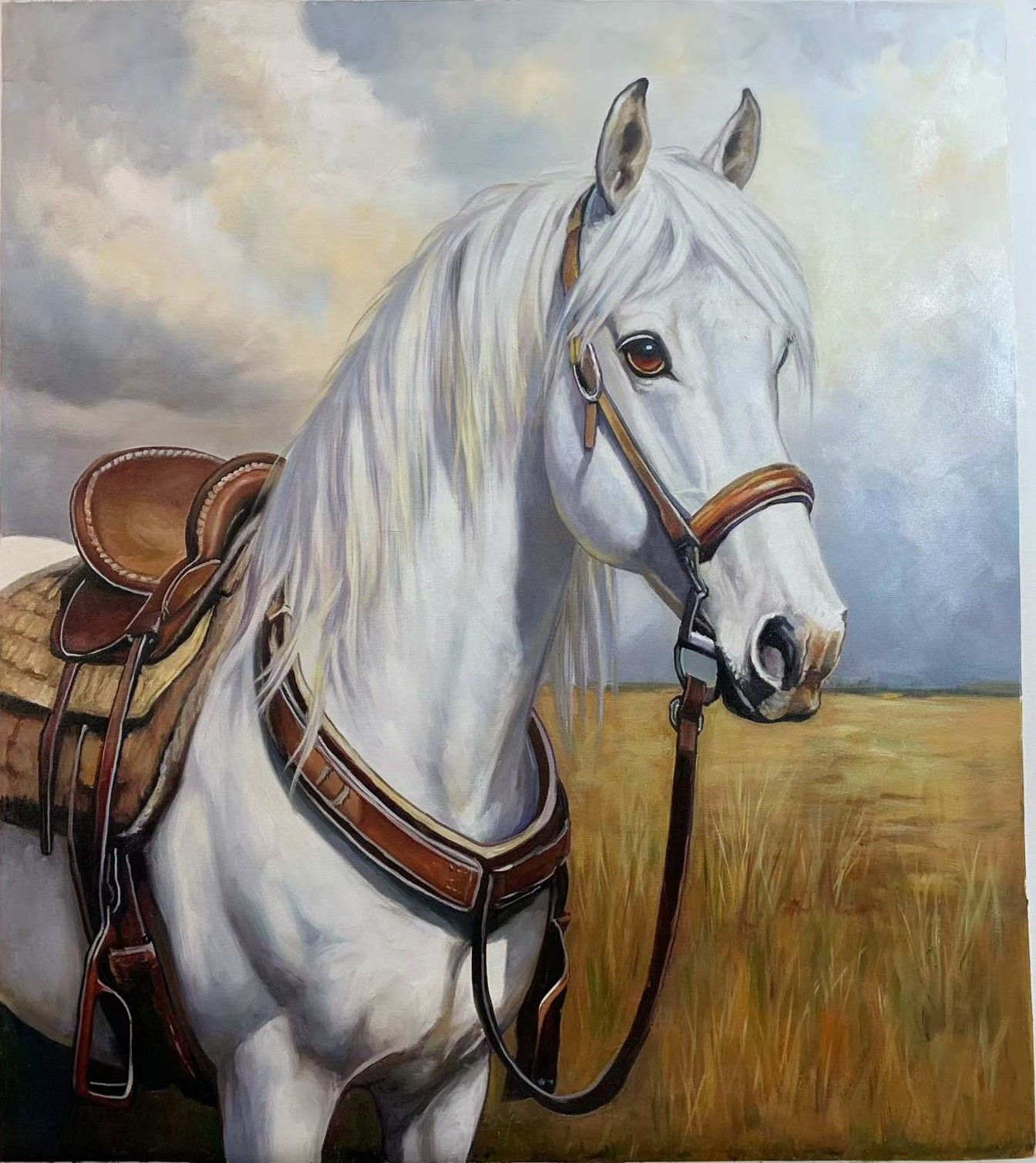 A white horse wearing a western saddle and bridle beneath a cloudy sky.