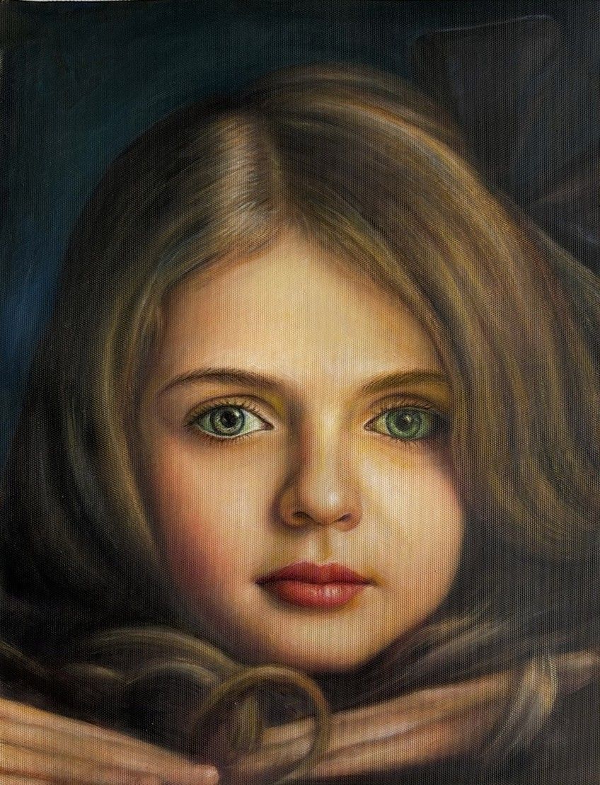 A young girl with long brown hair and green eyes against a dark ground.