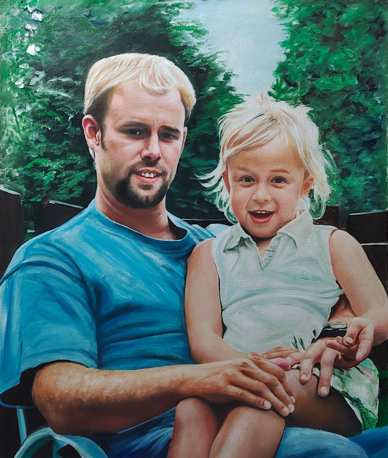 A father holding his smiling daughter in a garden setting.