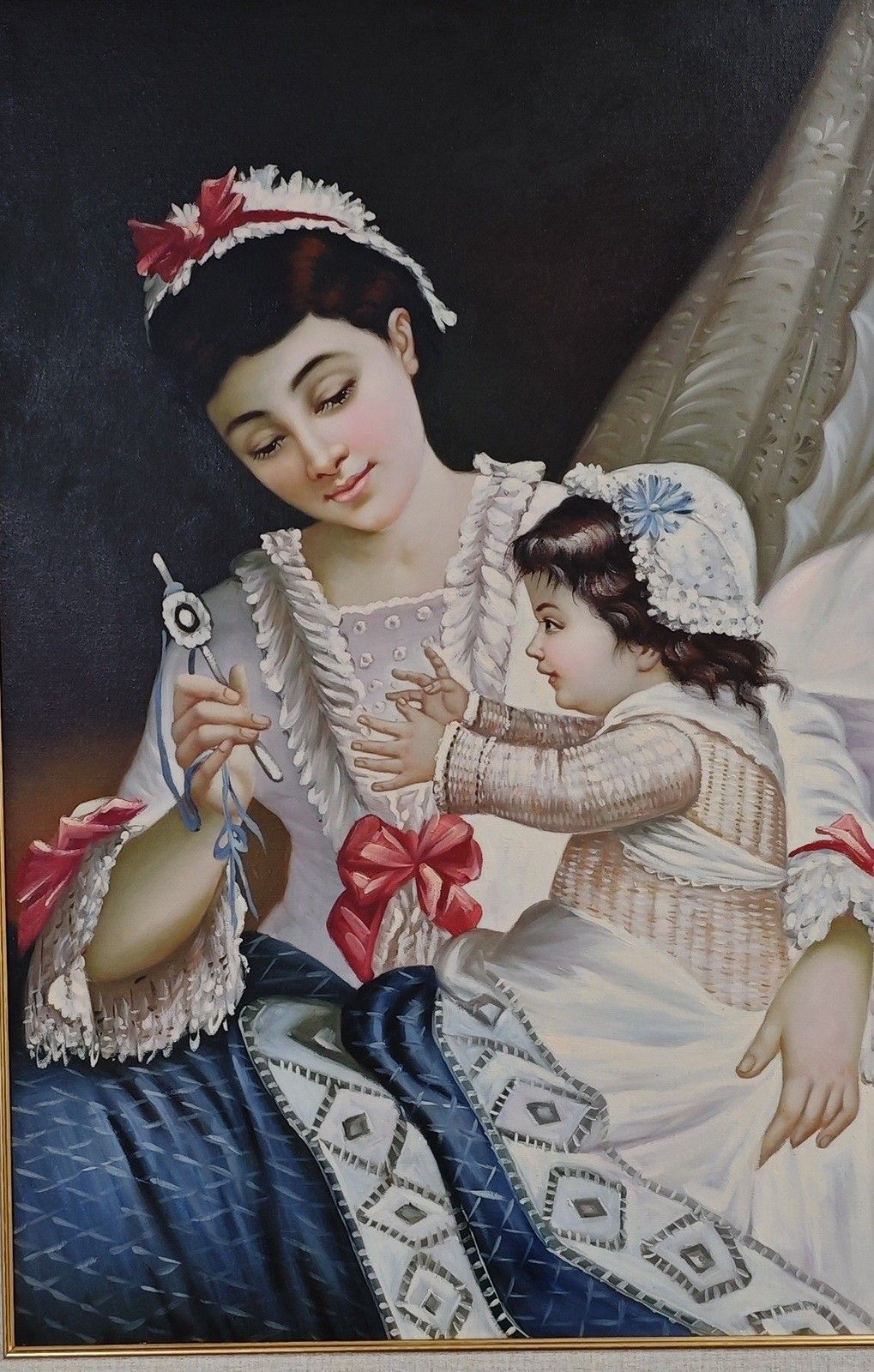 A mother and child share a quiet moment in this classical portrait with dark drapery and ornate clothing.